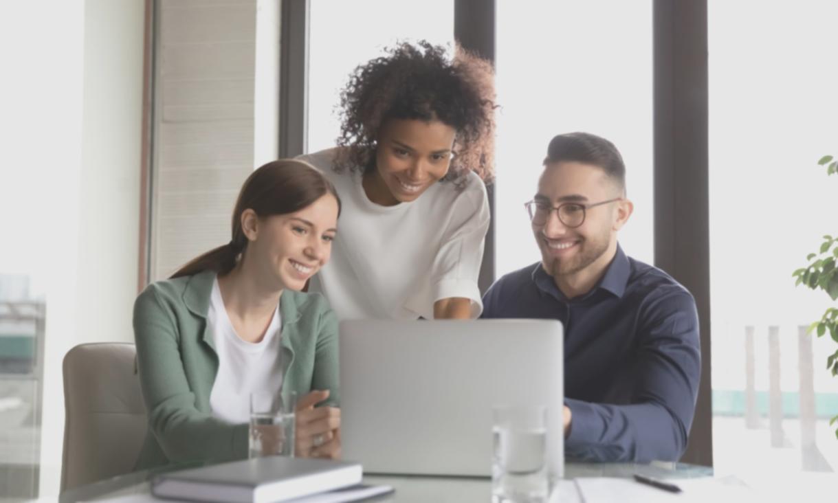 Instructor reviewing student feedback on laptop